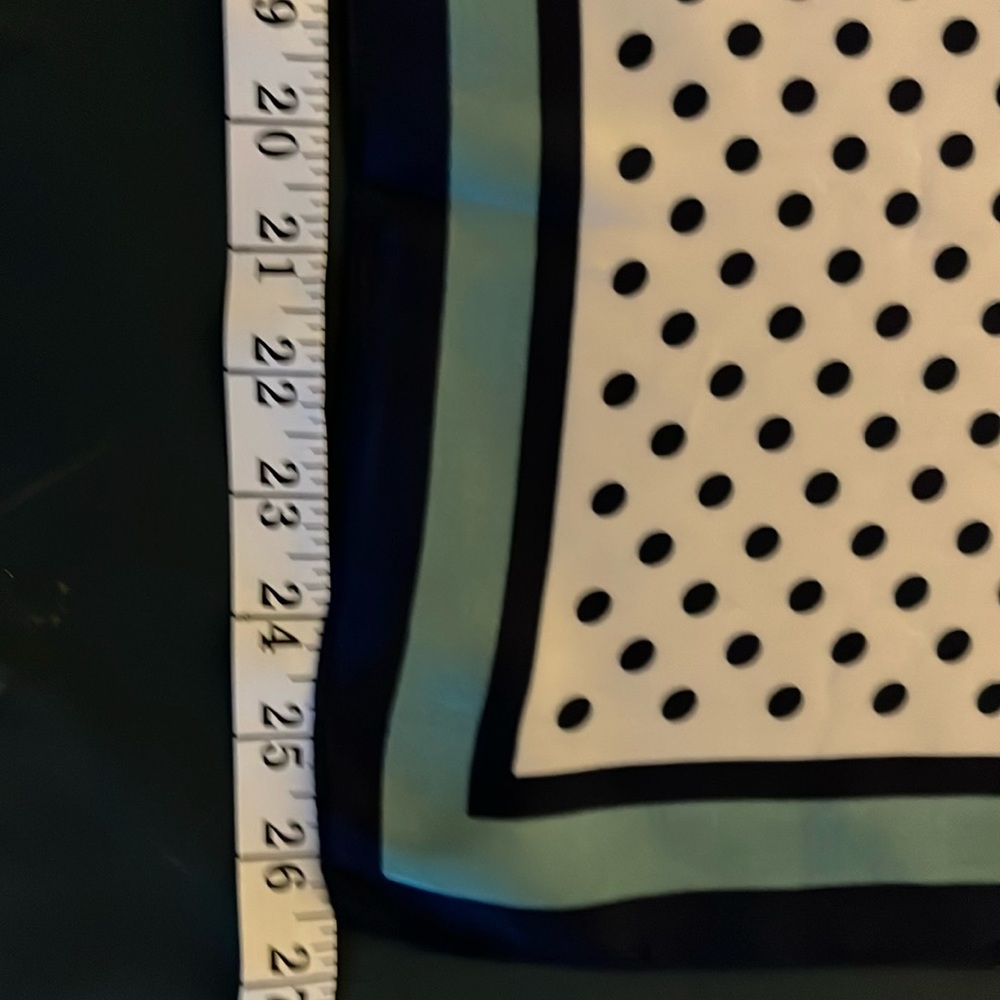 Scarf with black dots on white.